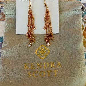 Rose gold Kendra Scott drop earrings.